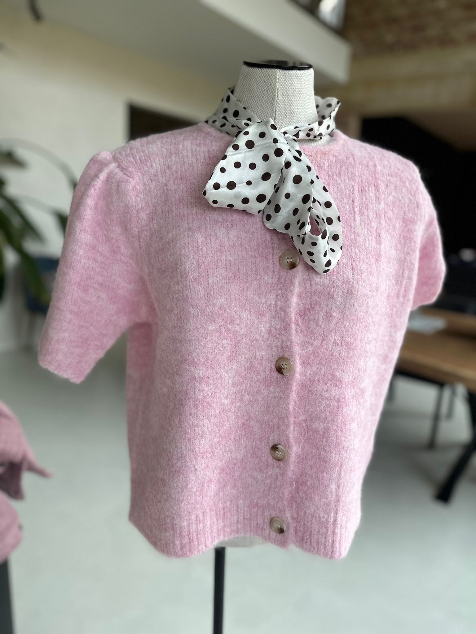 Cardigan with a polka dot bow